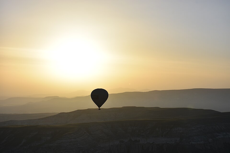 Hot air balloon at sunrise over Cappadocia, Turk…